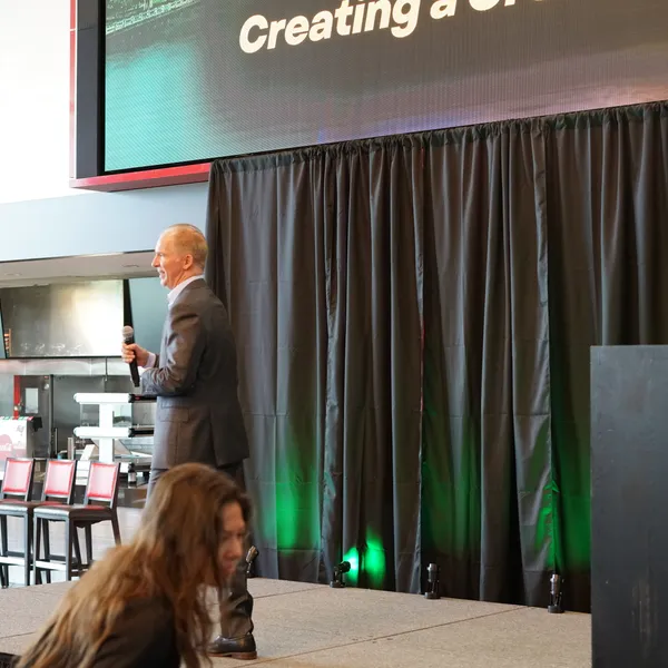 David Lee Jensen opening a keynote with his signature framework on the screen