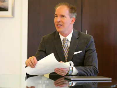 David Lee Jensen laughing in an advisory meeting at his office