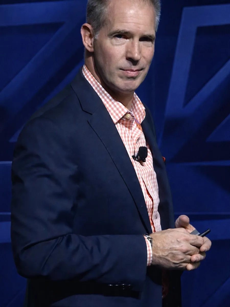 David Lee Jensen on stage, mid-presentation