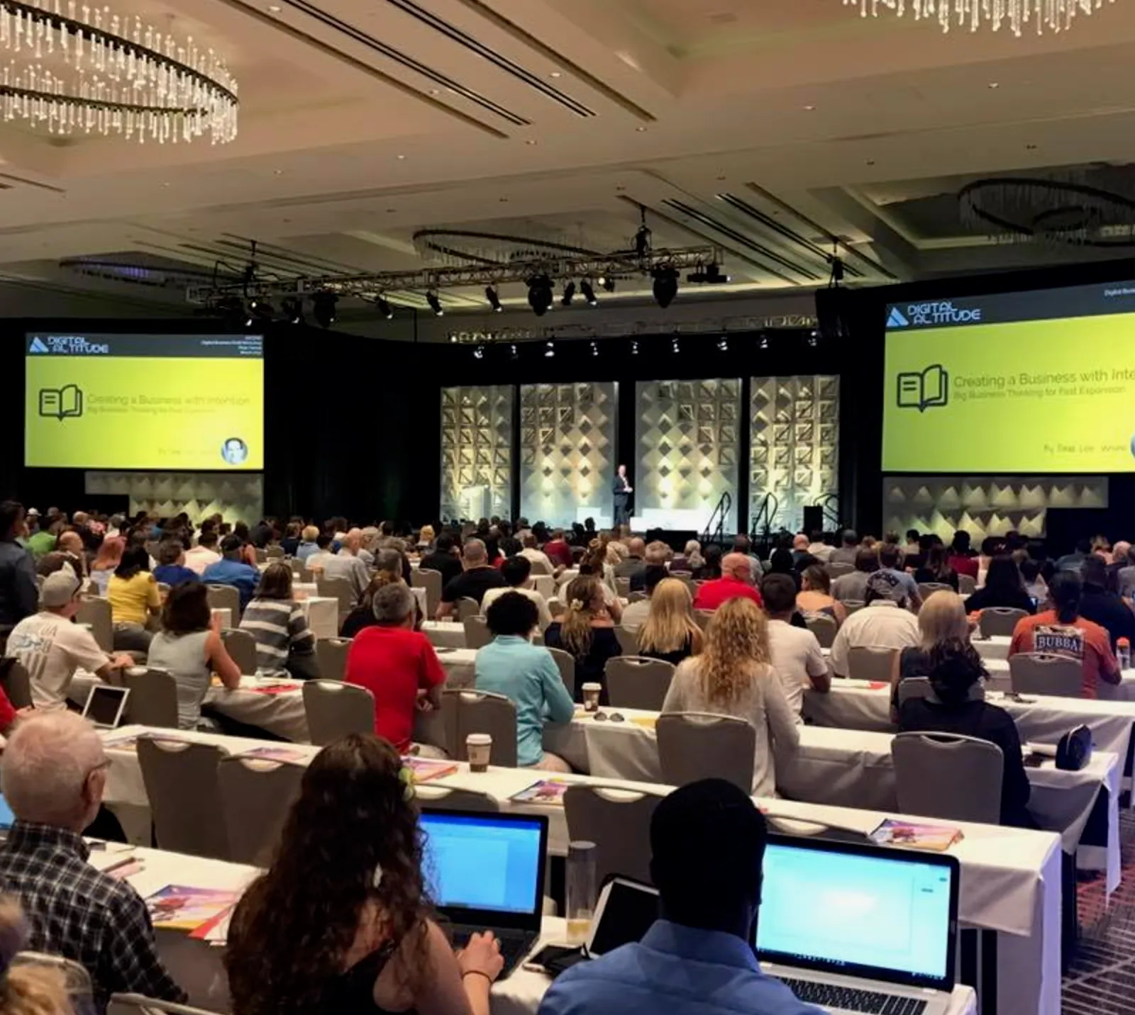 David Lee Jensen punctuating a point for the audience at a keynote