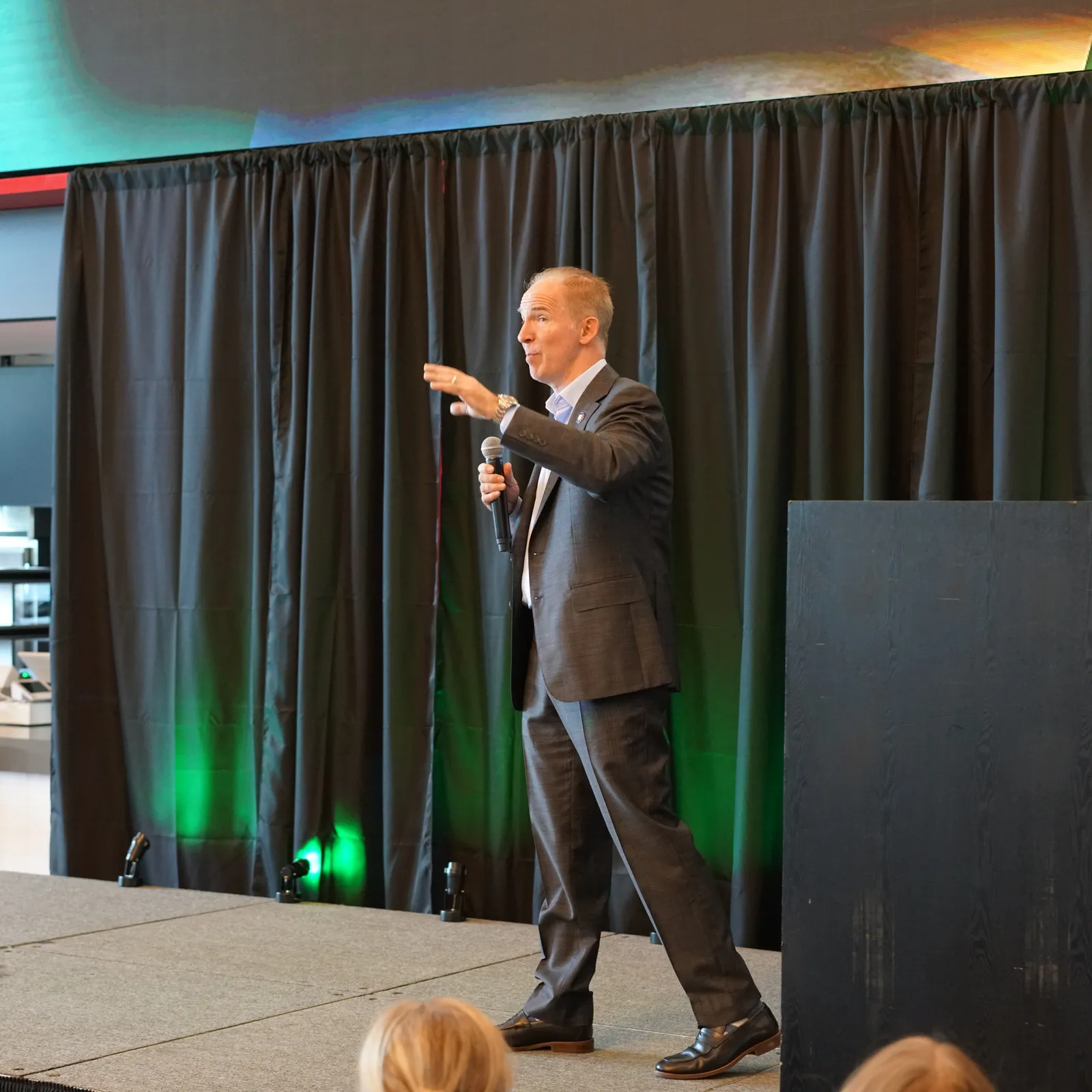 David Lee Jensen punctuating a point for the audience at a keynote