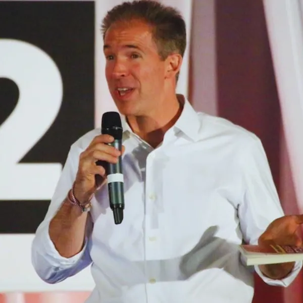 David Lee Jensen delivering a keynote at a conference venue